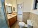 Main bathroom with shower and toilet at 13660 Se 80Th Ave, Summerfield, FL 34491