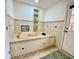 Relaxing bathroom with a large built-in bathtub at 13660 Se 80Th Ave, Summerfield, FL 34491