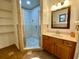 Bathroom with walk-in shower and vanity at 13660 Se 80Th Ave, Summerfield, FL 34491