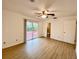 Bedroom with sliding door to deck at 13660 Se 80Th Ave, Summerfield, FL 34491