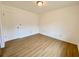 Simple bedroom with light walls and wood-look floors at 13660 Se 80Th Ave, Summerfield, FL 34491