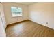 Simple bedroom with large window and closet at 13660 Se 80Th Ave, Summerfield, FL 34491