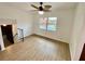 Bright Gathering room featuring a pool view and laminate flooring at 13660 Se 80Th Ave, Summerfield, FL 34491
