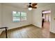 Bright Gathering room with pool view and laminate flooring at 13660 Se 80Th Ave, Summerfield, FL 34491