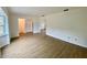 Spacious living room with laminate flooring and large windows at 13660 Se 80Th Ave, Summerfield, FL 34491