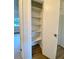 Walk-in pantry with five shelves at 13660 Se 80Th Ave, Summerfield, FL 34491
