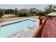Overlooking the expansive pool and patio from above at 13660 Se 80Th Ave, Summerfield, FL 34491