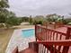 Enjoy the refreshing pool and deck overlooking the backyard at 13660 Se 80Th Ave, Summerfield, FL 34491