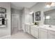 Elegant bathroom with double vanity and walk-in shower at 1912 Quail Fields Cir, Winter Haven, FL 33884