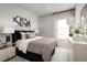 Bright bedroom featuring a comfortable bed and elegant decor at 1912 Quail Fields Cir, Winter Haven, FL 33884
