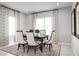 Elegant dining room with six chairs and large windows at 1912 Quail Fields Cir, Winter Haven, FL 33884