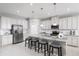 Modern kitchen with stainless steel appliances and granite countertops at 1912 Quail Fields Cir, Winter Haven, FL 33884