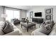 Spacious living room with comfortable seating and large TV at 1912 Quail Fields Cir, Winter Haven, FL 33884