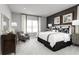 Main bedroom with king-size bed and calming decor at 1912 Quail Fields Cir, Winter Haven, FL 33884