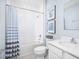 Clean bathroom with shower/tub combo, toilet and vanity with white countertop at 306 Biltmore Blvd, Dundee, FL 33838