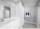 Bathroom with white vanity, tiled floor, and shower at 306 Biltmore Blvd, Dundee, FL 33838