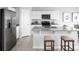 Kitchen with granite island, stainless steel appliances, and white cabinets at 306 Biltmore Blvd, Dundee, FL 33838