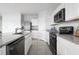 Modern kitchen with white cabinets and stainless steel appliances at 306 Biltmore Blvd, Dundee, FL 33838
