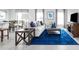 Living room with light sofa, blue rug, and wood coffee table at 306 Biltmore Blvd, Dundee, FL 33838
