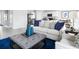 Living room features light-colored sofa and blue accents at 306 Biltmore Blvd, Dundee, FL 33838