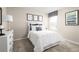 Cozy bedroom with white bedding and a dresser at 314 Biltmore Blvd, Dundee, FL 33838