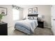 Charming bedroom with a blue and white comforter at 314 Biltmore Blvd, Dundee, FL 33838