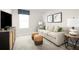 Cozy bonus room with a sofa, ottomans, and a media console at 314 Biltmore Blvd, Dundee, FL 33838