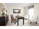 Home office with a desk, two chairs, and a neutral color scheme at 314 Biltmore Blvd, Dundee, FL 33838