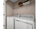Bright laundry room with washer and dryer and shelving at 314 Biltmore Blvd, Dundee, FL 33838