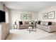 Bright living room featuring two sofas, a coffee table, and artwork at 314 Biltmore Blvd, Dundee, FL 33838