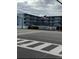 Exterior view of building with American flag at 3700 S Atlantic Ave # 405, New Smyrna Beach, FL 32169