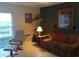 Living room with comfortable seating and decor at 3700 S Atlantic Ave # 405, New Smyrna Beach, FL 32169