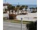 Ocean view with palm trees and roadside at 3700 S Atlantic Ave # 405, New Smyrna Beach, FL 32169