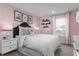 Charming bedroom with pink walls and decorative accents at 3785 Voyageurs Ct, Apopka, FL 32712