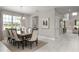 Bright dining room with large windows and seating for eight at 3785 Voyageurs Ct, Apopka, FL 32712
