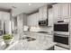 Modern kitchen with granite countertops and stainless steel appliances at 3785 Voyageurs Ct, Apopka, FL 32712