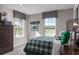 bedroom with plaid blanket, soccer-themed decor, gray window valances, and natural light at 3786 Sky Mountain Aly, Apopka, FL 32712