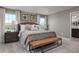 Main bedroom with decorative pillows, a bench seat, and a neutral color palette at 3786 Sky Mountain Aly, Apopka, FL 32712