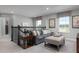Upstairs bonus room features a sofa, ottoman, decorative pillows and media console at 3786 Sky Mountain Aly, Apopka, FL 32712