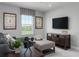 Upstairs bonus room with a large television and comfortable seating with a window view at 3786 Sky Mountain Aly, Apopka, FL 32712