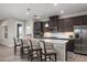 Stylish kitchen with stainless steel appliances, island seating, and modern finishes perfect for cooking at 3786 Sky Mountain Aly, Apopka, FL 32712