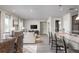 Open floor plan with a combined living room, dining area, and kitchen with seating at the granite island at 3786 Sky Mountain Aly, Apopka, FL 32712