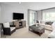 Living room with comfortable seating and sliding glass doors at 7427 Sw 108Th St, Ocala, FL 34476