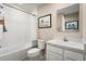 Clean bathroom with a white vanity, tub, and shower at 2206 Fluorescent Way, South Daytona, FL 32119