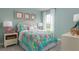 Charming bedroom with a tropical vibe and a queen bed at 3744 Sky Mountain Aly, Apopka, FL 32712