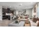 Open concept kitchen with island, stainless steel appliances, and hardwood floors at 3744 Sky Mountain Aly, Apopka, FL 32712