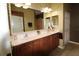 Well lit bathroom features double vanity and large mirror at 8320 Sw 82Nd Loop, Ocala, FL 34481