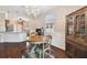 Bright dining area with hardwood floors, chandelier, and built-in hutch at 8320 Sw 82Nd Loop, Ocala, FL 34481