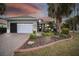 Attractive single-story home with landscaped yard and brick driveway at 8320 Sw 82Nd Loop, Ocala, FL 34481