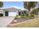 Attractive single-story home with landscaped yard and two-car garage at 8320 Sw 82Nd Loop, Ocala, FL 34481